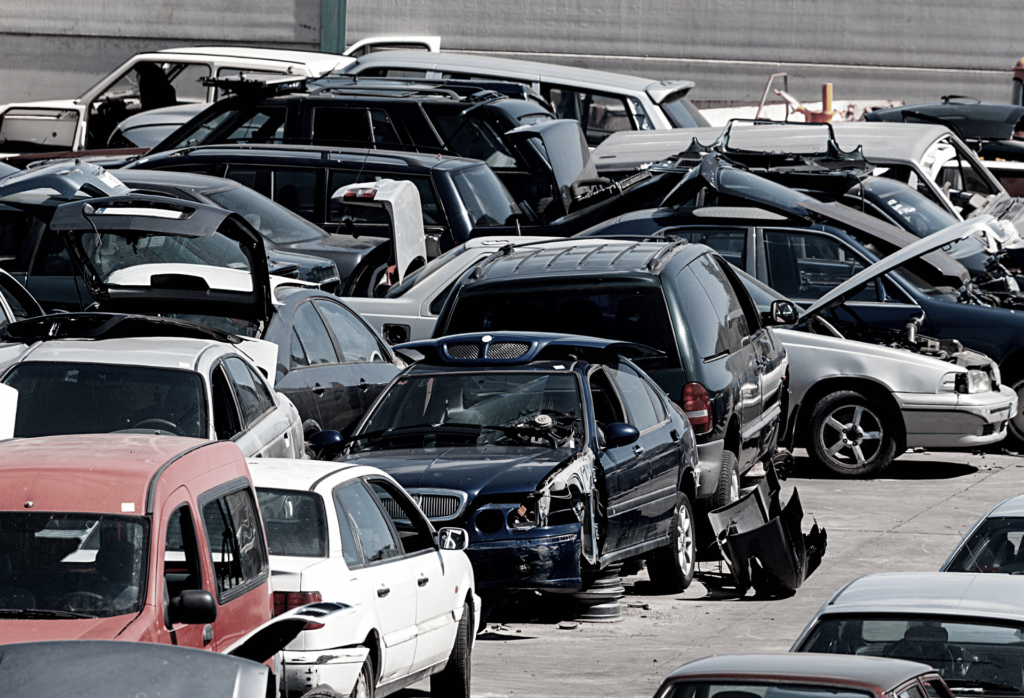 picture of a scrap yard with car that are brought in for scrapping